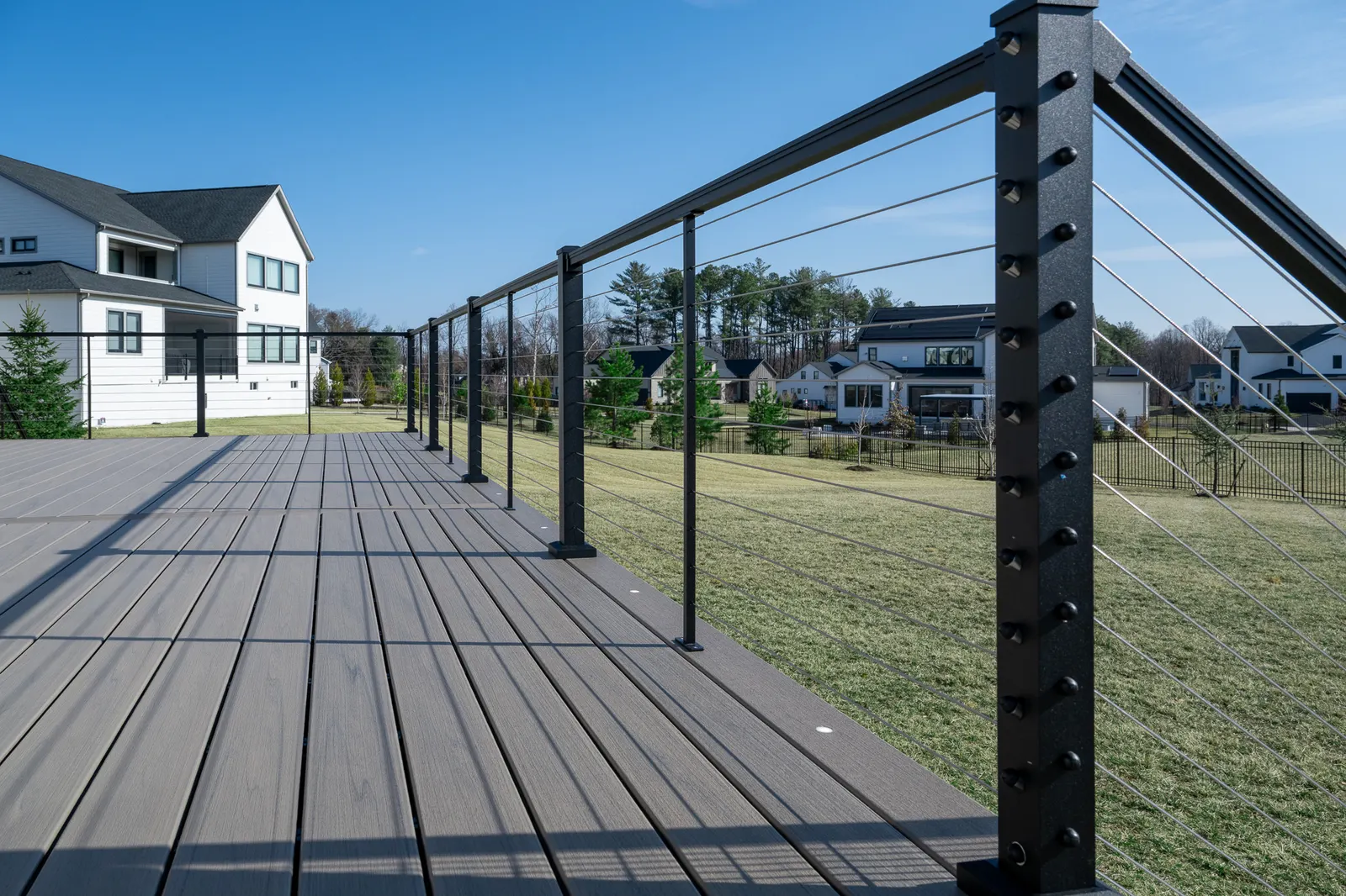 Composite deck boards and black cable railing